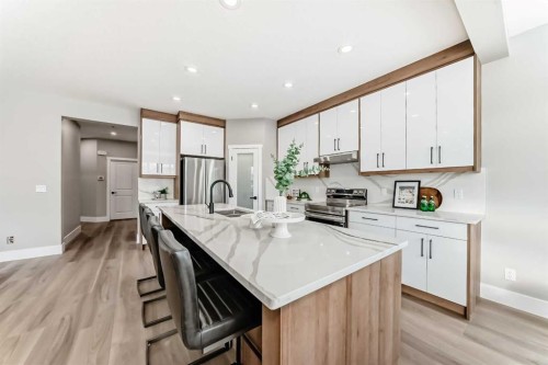 101 Auburn Springs Park Se, Calgary, AB - Indoor Photo Showing Kitchen With Double Sink With Upgraded Kitchen