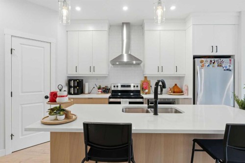 48 Seton Villas Se, Calgary, AB - Indoor Photo Showing Kitchen With Double Sink With Upgraded Kitchen