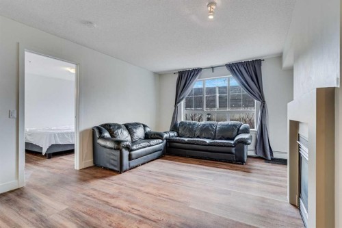 113-35 Richard Court Sw, Calgary, AB - Indoor Photo Showing Living Room