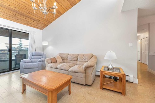410-3730 50 Street Nw, Calgary, AB - Indoor Photo Showing Living Room