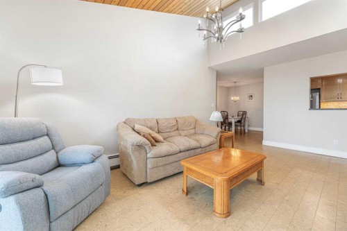 410-3730 50 Street Nw, Calgary, AB - Indoor Photo Showing Living Room