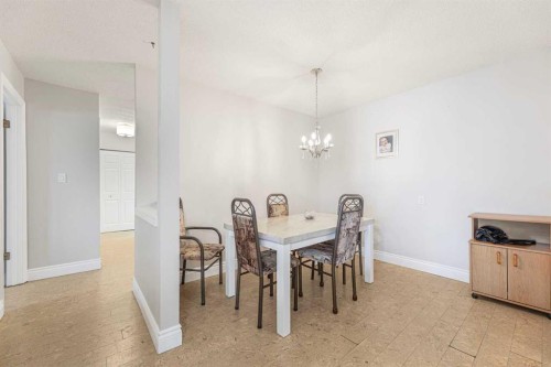 410-3730 50 Street Nw, Calgary, AB - Indoor Photo Showing Dining Room