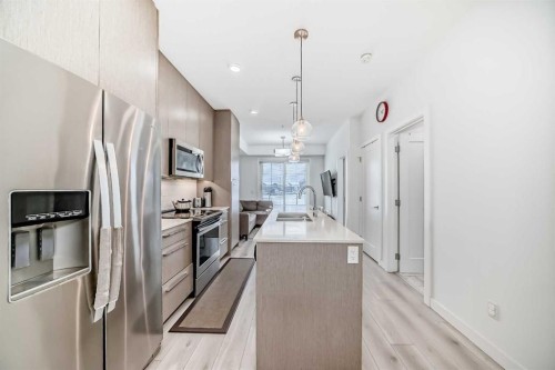 1231-76 Cornerstone Passage Ne, Calgary, AB - Indoor Photo Showing Kitchen With Stainless Steel Kitchen With Double Sink With Upgraded Kitchen