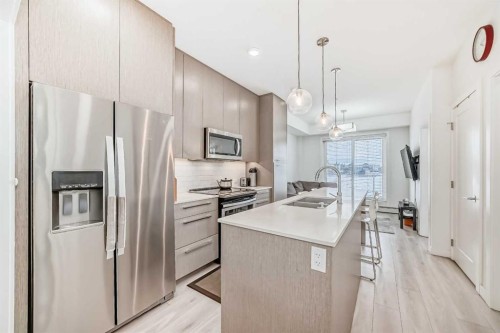1231-76 Cornerstone Passage Ne, Calgary, AB - Indoor Photo Showing Kitchen With Stainless Steel Kitchen With Double Sink With Upgraded Kitchen