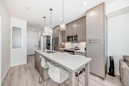 1231-76 Cornerstone Passage Ne, Calgary, AB - Indoor Photo Showing Kitchen With Stainless Steel Kitchen With Double Sink With Upgraded Kitchen