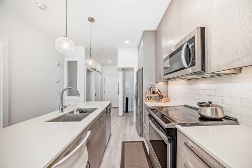 1231-76 Cornerstone Passage Ne, Calgary, AB - Indoor Photo Showing Kitchen With Double Sink With Upgraded Kitchen