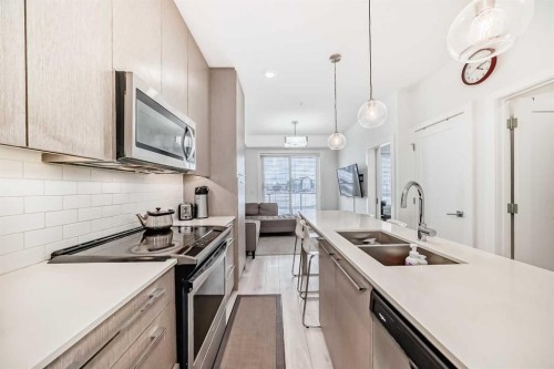 1231-76 Cornerstone Passage Ne, Calgary, AB - Indoor Photo Showing Kitchen With Stainless Steel Kitchen With Double Sink With Upgraded Kitchen