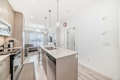 1231-76 Cornerstone Passage Ne, Calgary, AB - Indoor Photo Showing Kitchen With Stainless Steel Kitchen With Double Sink With Upgraded Kitchen