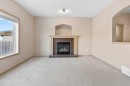 1083 Prairie Springs Hill Sw, Airdrie, AB  - Indoor Photo Showing Living Room With Fireplace 