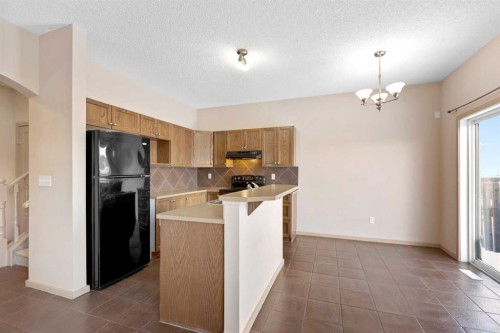 1083 Prairie Springs Hill Sw, Airdrie, AB - Indoor Photo Showing Kitchen