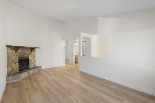 4 Cedarwood Rise Sw, Calgary, AB - Indoor Photo Showing Living Room With Fireplace
