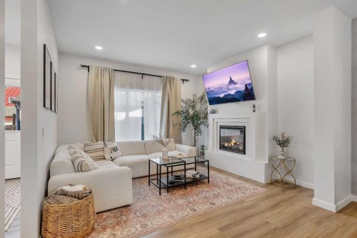 78 Mallard Heath Se, Calgary, AB - Indoor Photo Showing Living Room With Fireplace