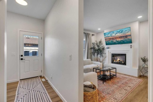 78 Mallard Heath Se, Calgary, AB - Indoor With Fireplace