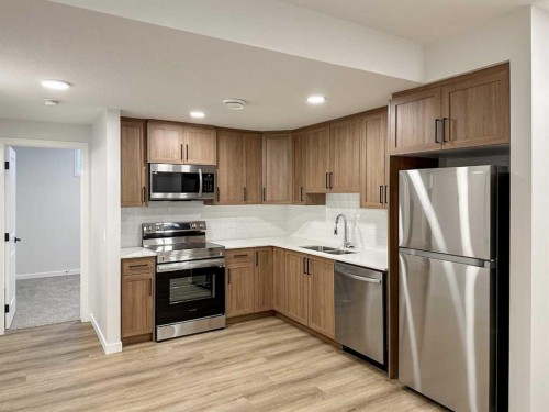 78 Mallard Heath Se, Calgary, AB - Indoor Photo Showing Kitchen With Double Sink