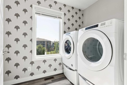 99 Precedence Hill, Cochrane, AB - Indoor Photo Showing Laundry Room