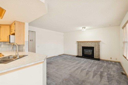2498 Catalina Boulevard Ne, Calgary, AB - Indoor With Fireplace