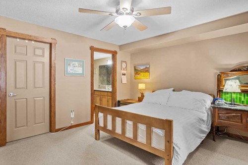 112-150 Crosbow Place, Canmore, AB - Indoor Photo Showing Bedroom