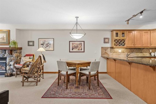 112-150 Crosbow Place, Canmore, AB - Indoor With Fireplace