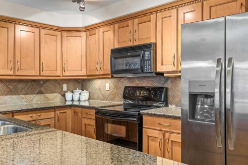 112-150 Crosbow Place, Canmore, AB - Indoor Photo Showing Kitchen