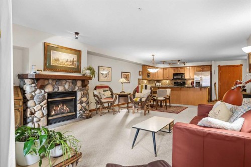 112-150 Crosbow Place, Canmore, AB - Indoor Photo Showing Living Room With Fireplace