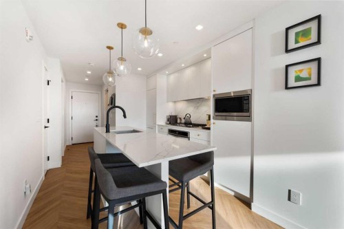 212-8505 Broadcast Avenue Sw, Calgary, AB - Indoor Photo Showing Kitchen With Upgraded Kitchen