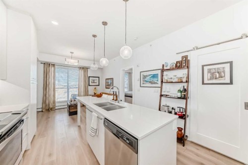 1406-76 Cornerstone Passage Ne, Calgary, AB - Indoor Photo Showing Kitchen With Double Sink With Upgraded Kitchen