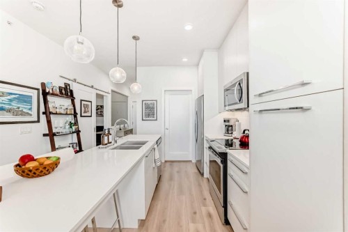 1406-76 Cornerstone Passage Ne, Calgary, AB - Indoor Photo Showing Kitchen With Double Sink With Upgraded Kitchen