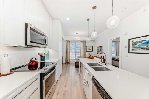 1406-76 Cornerstone Passage Ne, Calgary, AB - Indoor Photo Showing Kitchen With Stainless Steel Kitchen With Double Sink With Upgraded Kitchen