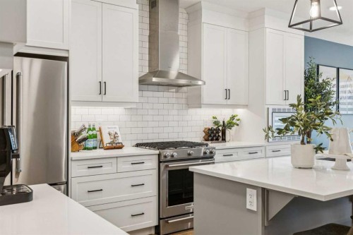 487 Rivercrest Road, Cochrane, AB - Indoor Photo Showing Kitchen With Upgraded Kitchen
