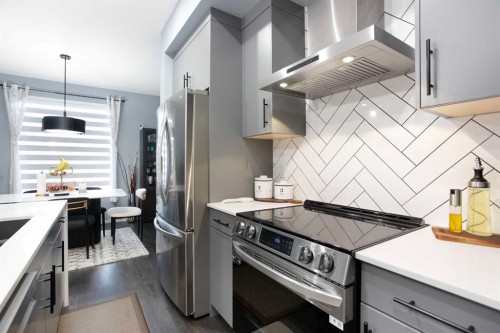 265 Belmont Way Sw, Calgary, AB - Indoor Photo Showing Kitchen With Stainless Steel Kitchen With Upgraded Kitchen