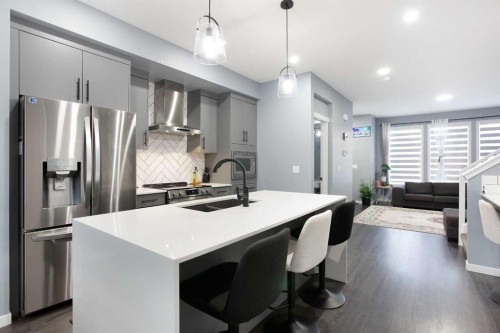 265 Belmont Way Sw, Calgary, AB - Indoor Photo Showing Kitchen With Stainless Steel Kitchen With Double Sink With Upgraded Kitchen
