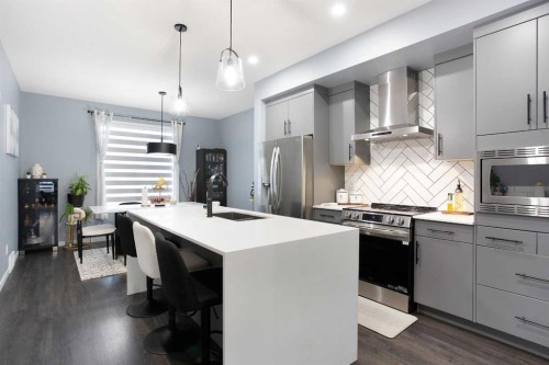 265 Belmont Way Sw, Calgary, AB - Indoor Photo Showing Kitchen With Stainless Steel Kitchen With Upgraded Kitchen