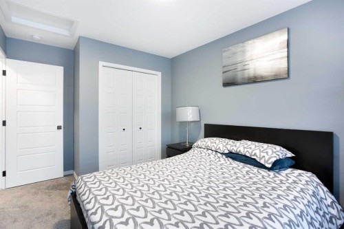 265 Belmont Way Sw, Calgary, AB - Indoor Photo Showing Bedroom