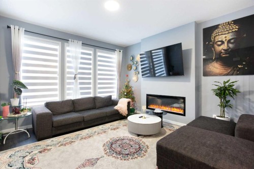 265 Belmont Way Sw, Calgary, AB - Indoor Photo Showing Living Room With Fireplace