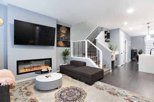 265 Belmont Way Sw, Calgary, AB - Indoor Photo Showing Living Room With Fireplace