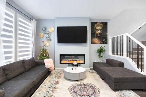 265 Belmont Way Sw, Calgary, AB - Indoor Photo Showing Living Room With Fireplace