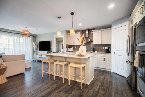 221-110 Auburn Meadows View Se, Calgary, AB - Indoor Photo Showing Kitchen With Stainless Steel Kitchen With Upgraded Kitchen