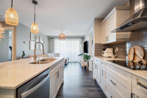 221-110 Auburn Meadows View Se, Calgary, AB - Indoor Photo Showing Kitchen With Double Sink