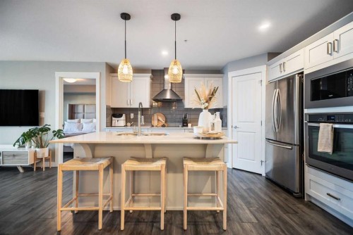 221-110 Auburn Meadows View Se, Calgary, AB - Indoor Photo Showing Kitchen With Stainless Steel Kitchen With Upgraded Kitchen