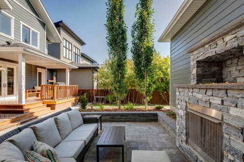419 47 Avenue Sw, Calgary, AB - Outdoor With Fireplace With Deck Patio Veranda With Exterior