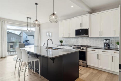 363 Precedence Hill, Cochrane, AB - Indoor Photo Showing Kitchen With Upgraded Kitchen