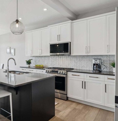 363 Precedence Hill, Cochrane, AB - Indoor Photo Showing Kitchen With Upgraded Kitchen