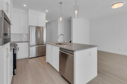 1321 South Point Parade Sw, Airdrie, AB - Indoor Photo Showing Kitchen With Upgraded Kitchen