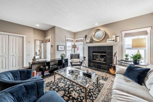 78 Ypres Green Sw, Calgary, AB - Indoor Photo Showing Living Room With Fireplace
