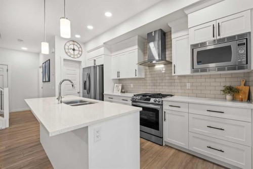 175 Creekstone Way Sw, Calgary, AB - Indoor Photo Showing Kitchen With Double Sink With Upgraded Kitchen