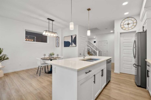 175 Creekstone Way Sw, Calgary, AB - Indoor Photo Showing Kitchen With Double Sink With Upgraded Kitchen