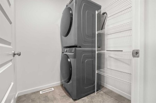 175 Creekstone Way Sw, Calgary, AB - Indoor Photo Showing Laundry Room