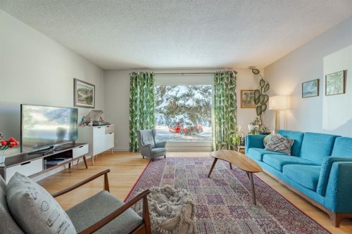 84 Thornaby Crescent Nw, Calgary, AB - Indoor Photo Showing Living Room