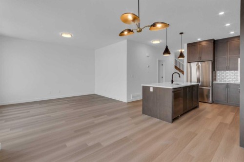 1325 South Point Parade Sw, Airdrie, AB - Indoor Photo Showing Kitchen With Upgraded Kitchen