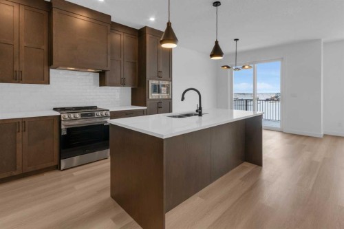 1325 South Point Parade Sw, Airdrie, AB - Indoor Photo Showing Kitchen With Upgraded Kitchen